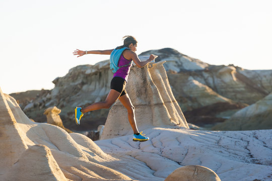 Native American woman running in desert