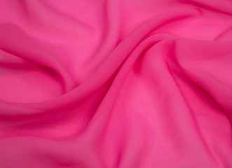 a delicate faux silk fabric red lined with soft folds