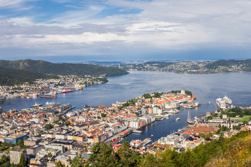 Fototapeta na wymiar Bergen City, Scenic Aerial View Panorama harbour Cityscape under Dramatic Sky at sunset summer from Top of Mount Floyen Glass Balcony Viewpoint mountain