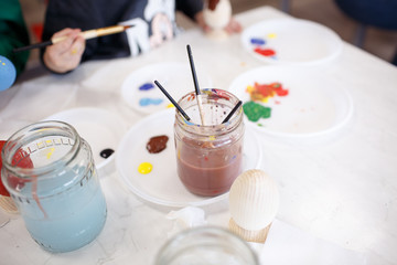 Process painting wooden Easter eggs