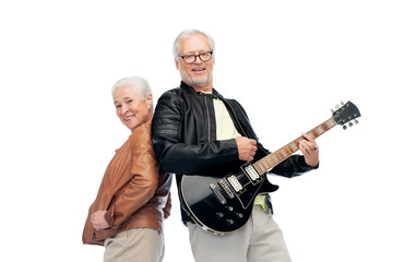 happy senior couple with electric guitar