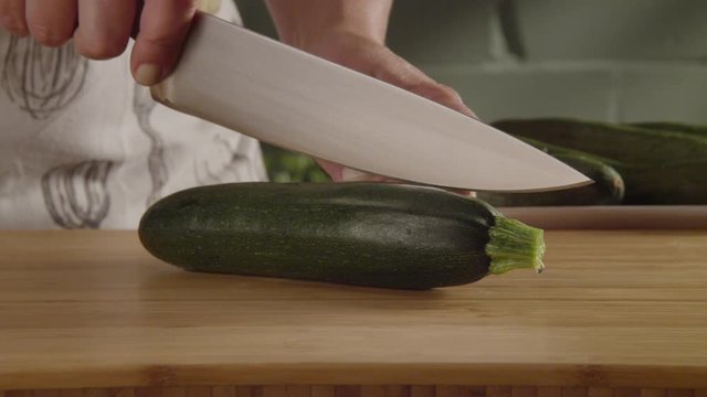 Woman cutting zucchini 