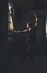 Ballet dancer practicing indoors.