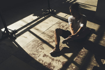 Fototapeta premium Ballet dancer practicing indoors.