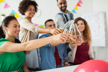 happy team with drinks celebrating at office party