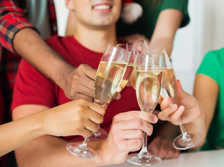 friends clinking glasses of champagne at party