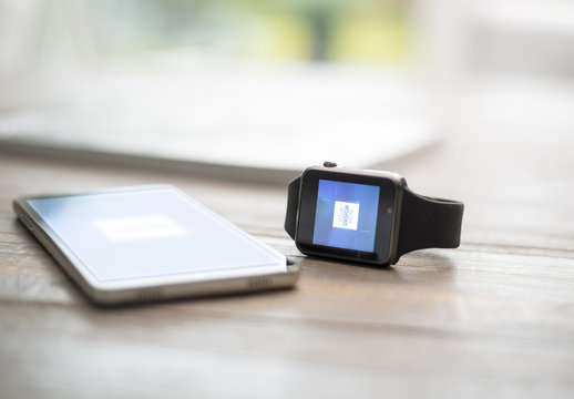 Smartwatch and Smarthone on Wooden Table Mockup