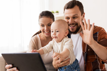 mother, father and baby with tablet pc at home - obrazy, fototapety, plakaty