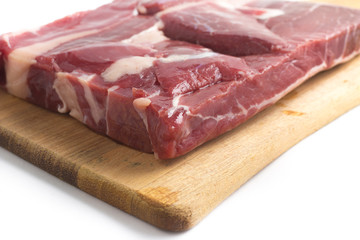 Jerked Beef. Brazilian Carne seca on a wooden board