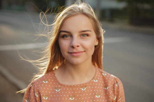 Portrait of beautiful young woman standing outdoors