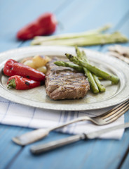 steak on blue background