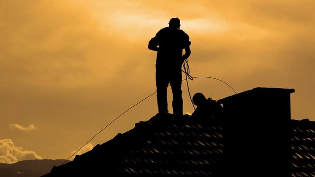 Silhouette at Sunset Makes Chimney sweeping and repari services