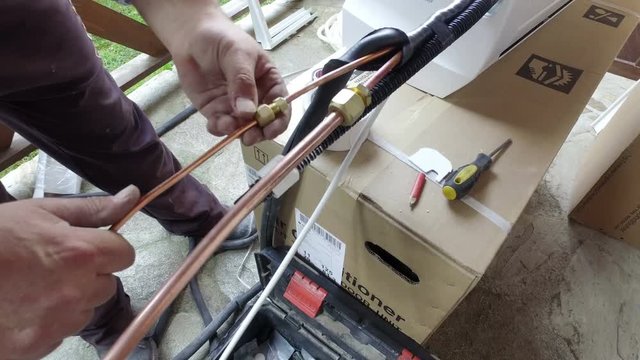 Installing air conditioner pipes