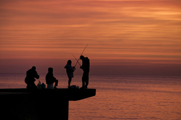 People Fishing at Breakwater