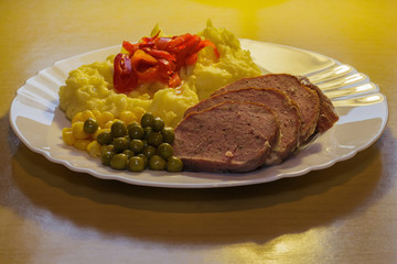 poultry cut vegetables and potato mash overall view