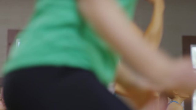 Medium panning shot of women dancing in exercise class / Orem, Utah, United States