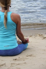 Fototapeta na wymiar yoga lotus position on beach background copy space calm beach ocean