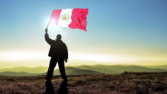 Successful silhouette man winner waving Peru flag on top of the mountain peak, Cinemagraph LOOP background