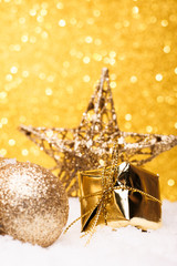 Christmas composition of Christmas tree toys on a gold background