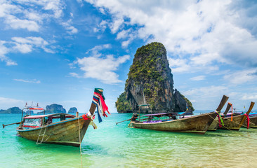 Amazing view of beautiful beach with longtale boats. Location: Railay beach, Krabi, Thailand, Andaman Sea. Artistic picture. Beauty world.