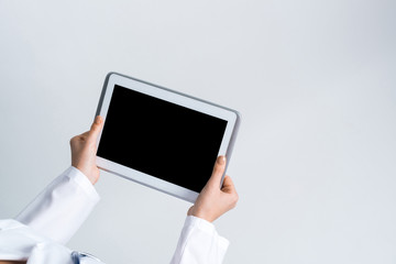 Close of female doctor hands working with tablet pc computer