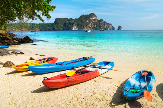 Amazing view of beautiful beach with kayaks on the sand. Location: Phi Phi Island, Krabi province, Thailand, Andaman Sea. Artistic picture. Beauty world.