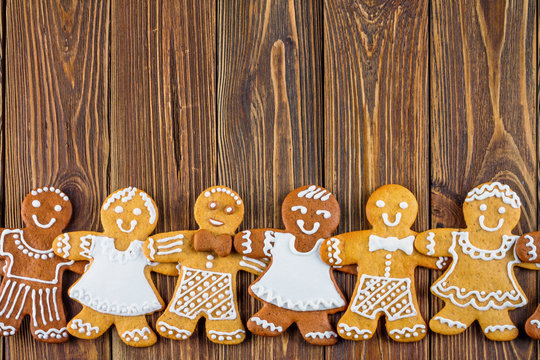 The Christmas or New Year background - Homemade christmas gingerbreads on wooden boards