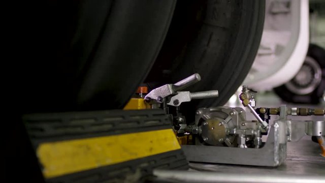 Chassis wheels airplane tire rubber close-up. Landing gear airplane in hangar chassis rubber close-up