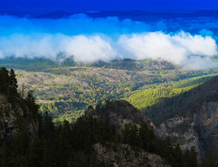 Fototapeta na wymiar Horizontal vivid cloudscape in high altitude mountains
