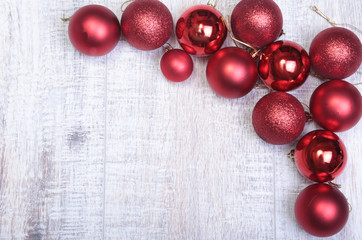 Red christmas balls on a wooden background
