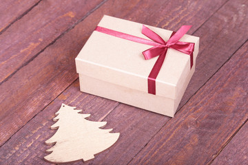 Gift boxes with bow on wood background