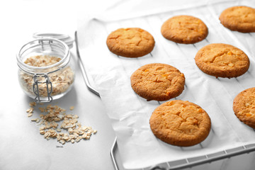 Delicious oatmeal cookies on table