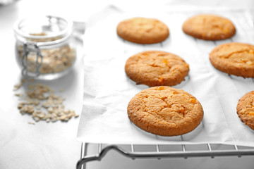 Delicious oatmeal cookies on table