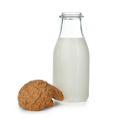 Delicious oatmeal cookies with bottle of milk on white background