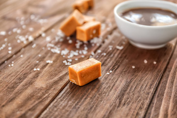 Fototapeta na wymiar Salted caramel candies on wooden table