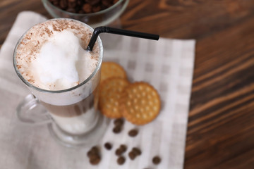 Glass with latte macchiato on fabric