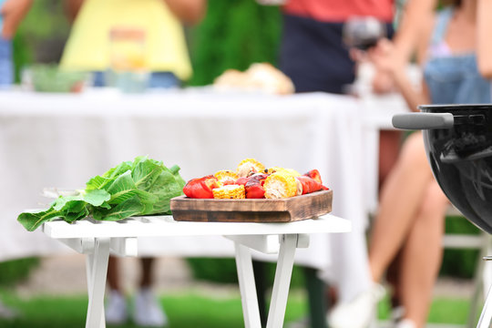 Table with tasty vegetables prepared on barbecue grill, outdoors