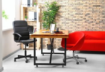 Interior of modern room with comfortable workplace