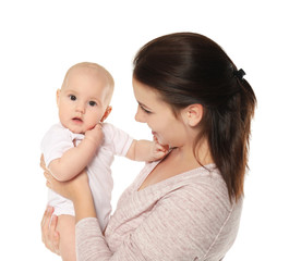Happy young woman with cute baby on white background
