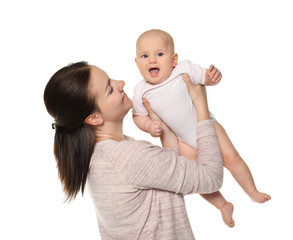 Happy young woman with cute baby on white background