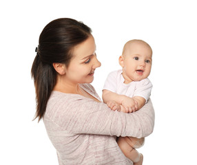 Happy young woman with cute baby on white background