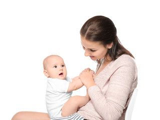 Happy young woman with cute baby on white background