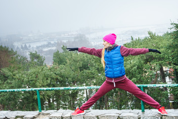 Woman exercising outside during autumn