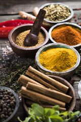 Variety of spices and herbs on kitchen table