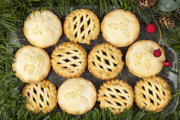 Selection of mince pies on a platter decorated for christmas © RCH Photographic
