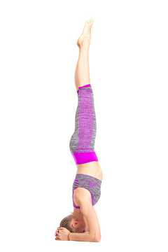 Women who do yoga perform hrad standing.
