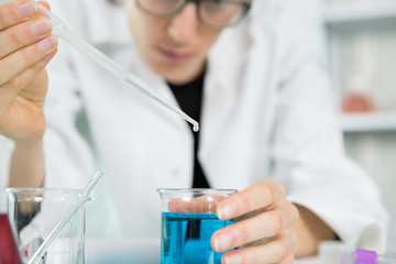young women science professional pipetting