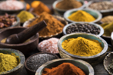 Variety of spices and herbs on kitchen table