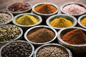 Variety of spices and herbs on kitchen table