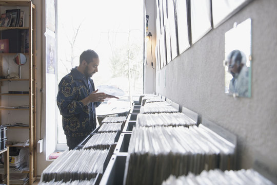 Young man shopping for records